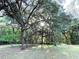 Sunlight streams through the trees, highlighting the beauty and serenity of this wooded homesite at 3579 Sw Shorewood Dr, Dunnellon, FL 34431