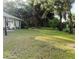 Expansive yard provides a serene setting with mature trees, offering ample space for outdoor activities and relaxation at 3579 Sw Shorewood Dr, Dunnellon, FL 34431