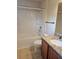 Bright bathroom featuring granite counter tops, shower and bath combination, and vanity lighting at 3918 Sw 57Th Ave, Ocala, FL 34474