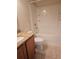 Cozy bathroom showcasing granite counter tops, shower and bath combination, and ample lighting at 3918 Sw 57Th Ave, Ocala, FL 34474