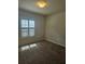 Bright bedroom with neutral carpet, ceiling light, and shuttered window allowing for adjustable natural light at 3918 Sw 57Th Ave, Ocala, FL 34474