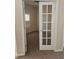 Office space featuring neutral walls, white trim, and a glass paneled door at 3918 Sw 57Th Ave, Ocala, FL 34474