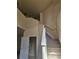 Carpeted stairway featuring a white railing leading to the upper level of the home at 3918 Sw 57Th Ave, Ocala, FL 34474