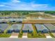Aerial view of the property showcasing a well-maintained lawn, brick driveway, and desirable neighborhood location at 4411 Nw 53Rd Ct, Ocala, FL 34482