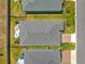 This aerial shot displays the home's expansive backyard and patio within a neatly landscaped, fenced property at 4411 Nw 53Rd Ct, Ocala, FL 34482
