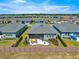 This aerial view highlights the home's backyard, including a cozy patio with outdoor seating within a fenced yard at 4411 Nw 53Rd Ct, Ocala, FL 34482