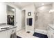 Modern bathroom with a granite countertop, a spacious shower, and a walk-in closet at 4411 Nw 53Rd Ct, Ocala, FL 34482