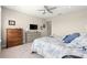 Comfortable bedroom featuring neutral walls and carpet, and a ceiling fan at 4411 Nw 53Rd Ct, Ocala, FL 34482