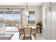 Dining area with patio door access to the backyard and modern chandelier at 4411 Nw 53Rd Ct, Ocala, FL 34482