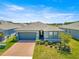 An exterior view of the home in a suburban neighborhood with well-maintained landscaping and inviting curb appeal at 4411 Nw 53Rd Ct, Ocala, FL 34482