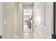 Bright hallway showcasing tile flooring leading to a carpeted bedroom at 4411 Nw 53Rd Ct, Ocala, FL 34482