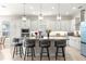 Modern kitchen featuring a large island with seating, stainless steel appliances, and ample cabinetry at 4411 Nw 53Rd Ct, Ocala, FL 34482