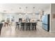Bright open kitchen with an island, barstool seating, and stainless steel appliances; perfect for entertaining at 4411 Nw 53Rd Ct, Ocala, FL 34482