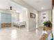 Neutral tiled entryway with a den-like space and view into the living space at 4411 Nw 53Rd Ct, Ocala, FL 34482