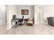 Neutral office space featuring a desk and comfortable chair, adjacent to a seating area at 4411 Nw 53Rd Ct, Ocala, FL 34482