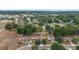 This aerial view shows a community with tree-lined streets and well-maintained homes at 4624 Se 32Nd Pl, Ocala, FL 34480