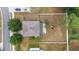 Aerial shot showing house, driveway, spacious backyard with playset, and fence at 4624 Se 32Nd Pl, Ocala, FL 34480