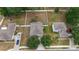 This aerial view showcases a home with a spacious yard, white fence, and mature trees at 4624 Se 32Nd Pl, Ocala, FL 34480