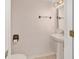 Cozy half bathroom with pedestal sink and decorative fixtures at 4624 Se 32Nd Pl, Ocala, FL 34480