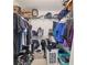 Walk-in closet with metal racks and shelves filled with clothes at 4624 Se 32Nd Pl, Ocala, FL 34480