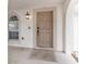 Covered front porch with decorative door rug and updated light fixture near the front door at 4624 Se 32Nd Pl, Ocala, FL 34480