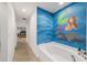 Hallway leading to a bathroom with a mermaid mural at 4624 Se 32Nd Pl, Ocala, FL 34480