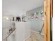 Hallway leading to a spacious loft featuring decorative wall art at 4624 Se 32Nd Pl, Ocala, FL 34480
