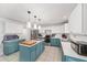 Bright kitchen features stainless appliances, white counters, and blue lower cabinets at 4624 Se 32Nd Pl, Ocala, FL 34480