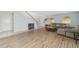 Bright living room with hardwood floors, arch windows, and neutral paint at 4624 Se 32Nd Pl, Ocala, FL 34480