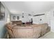 Spacious living room with large sectional sofa and built-in shelving at 4624 Se 32Nd Pl, Ocala, FL 34480