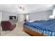 Main bedroom with a ceiling fan, windows, and a comfortable sitting area at 4624 Se 32Nd Pl, Ocala, FL 34480