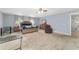 Main bedroom featuring a large bed, dresser, and windows for natural light at 4624 Se 32Nd Pl, Ocala, FL 34480