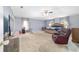 Main bedroom featuring windows, a ceiling fan, and ample space for furniture at 4624 Se 32Nd Pl, Ocala, FL 34480