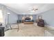 Large main bedroom featuring carpet floors and windows with curtains at 4624 Se 32Nd Pl, Ocala, FL 34480