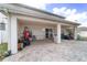 Covered patio offering shade with brick flooring and backyard at 4624 Se 32Nd Pl, Ocala, FL 34480