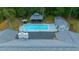 Aerial view of a home with a pool, outdoor seating, and a wooded backyard at 4710 Se 30Th Ct, Ocala, FL 34480
