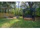 Private backyard featuring a cozy fire pit area with comfortable seating and swing at 4710 Se 30Th Ct, Ocala, FL 34480