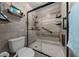 Beautiful bathroom with a tile shower, glass door, and grab bar at 4710 Se 30Th Ct, Ocala, FL 34480