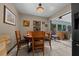 Cozy dining room features a wooden table, chair set, and natural light at 4710 Se 30Th Ct, Ocala, FL 34480