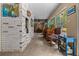 Cozy living room featuring a painted brick wall and an eclectic mix of furnishings at 4710 Se 30Th Ct, Ocala, FL 34480