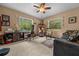 Home office with large windows, a desk, and a comfortable seating area at 4710 Se 30Th Ct, Ocala, FL 34480