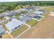 An aerial shot of the neighborhood showcases well-maintained homes and lawns at 4743 Nw 11Th Ct, Ocala, FL 34475