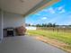 Covered patio offers views of a spacious backyard, perfect for entertaining at 4743 Nw 11Th Ct, Ocala, FL 34475