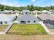A fenced backyard features a well-maintained lawn and complements the home's exterior at 4743 Nw 11Th Ct, Ocala, FL 34475