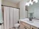 Bathroom featuring a single vanity with a neutral color palette and decorative lighting at 4743 Nw 11Th Ct, Ocala, FL 34475