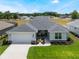 Beautiful single-story home with a well-manicured lawn and attached two-car garage at 4743 Nw 11Th Ct, Ocala, FL 34475