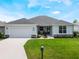 Charming single-story home featuring a welcoming front porch and neatly kept lawn at 4743 Nw 11Th Ct, Ocala, FL 34475