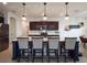 Stylish kitchen island with bar stool seating, pendant lighting, and modern appliances at 4743 Nw 11Th Ct, Ocala, FL 34475