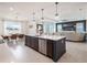 Spacious kitchen island with white countertops overlooking the dining and living areas at 4743 Nw 11Th Ct, Ocala, FL 34475