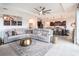 Spacious living room with an open layout, modern furniture, and a view into the kitchen at 4743 Nw 11Th Ct, Ocala, FL 34475